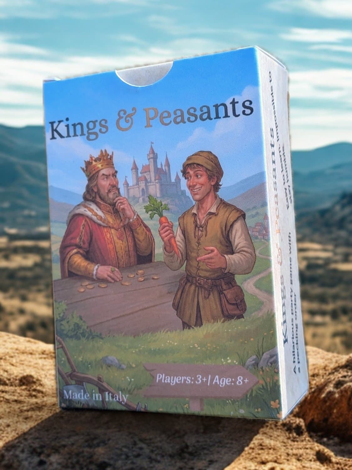 The front of the Kings & Peasants box: the King and the Peasant at a table, a castle behind them